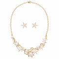 White ocean charm necklace and starfish earring set with faux pearls and gold-tone details by Browniecherry
